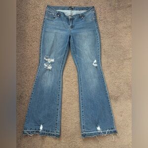 Fashionova medium wash low rise flare jeans